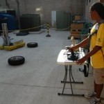 Yellow camper running an FRC robot.